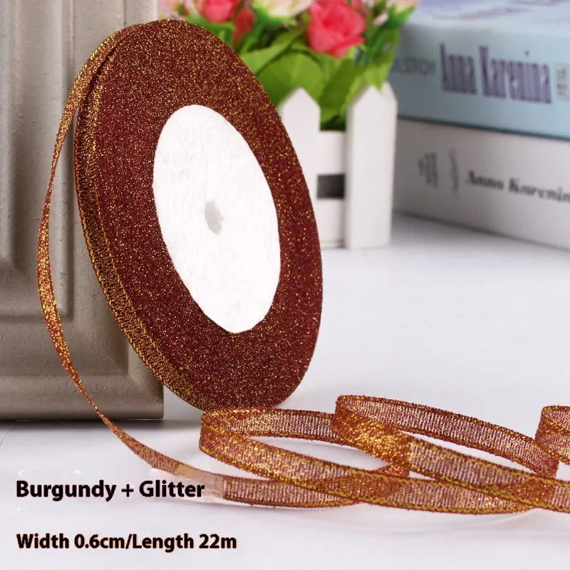 Roll of narrow 0.6cm wide polyester gift wrapping ribbon in assorted colours, showing 22 metre length.