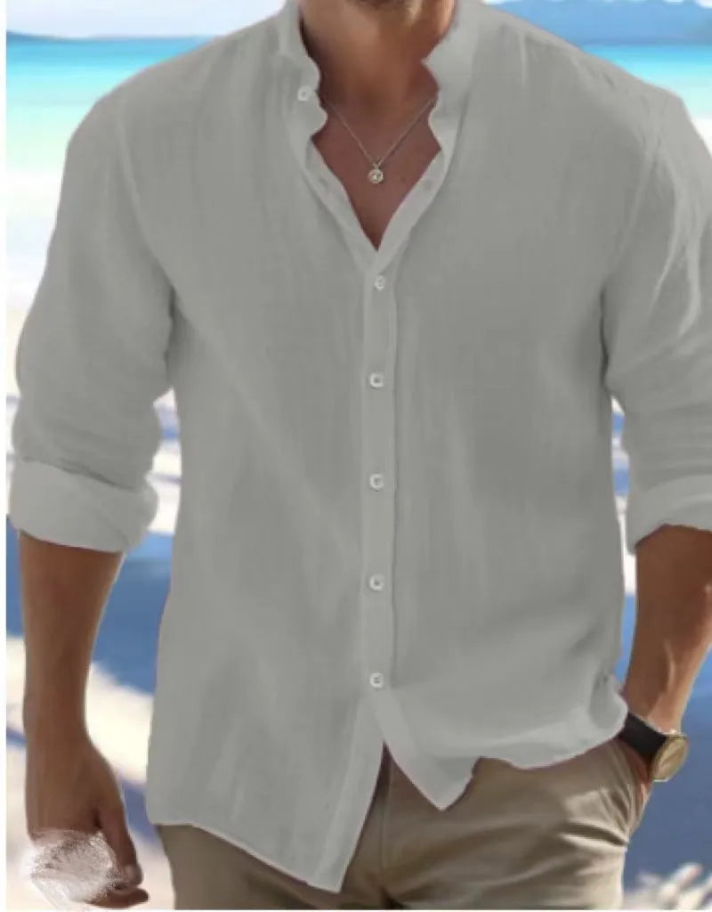 Men's light blue long-staple cotton casual summer shirt with button front and collar on a hanger.