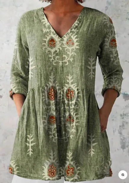 Women's printed loose wave dress with wide waist and three-quarter sleeves in a floral pattern.