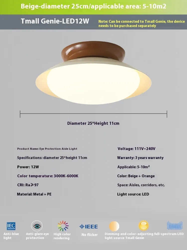 Modern cream-style flying saucer shaped ceiling lamp in a bedroom setting.