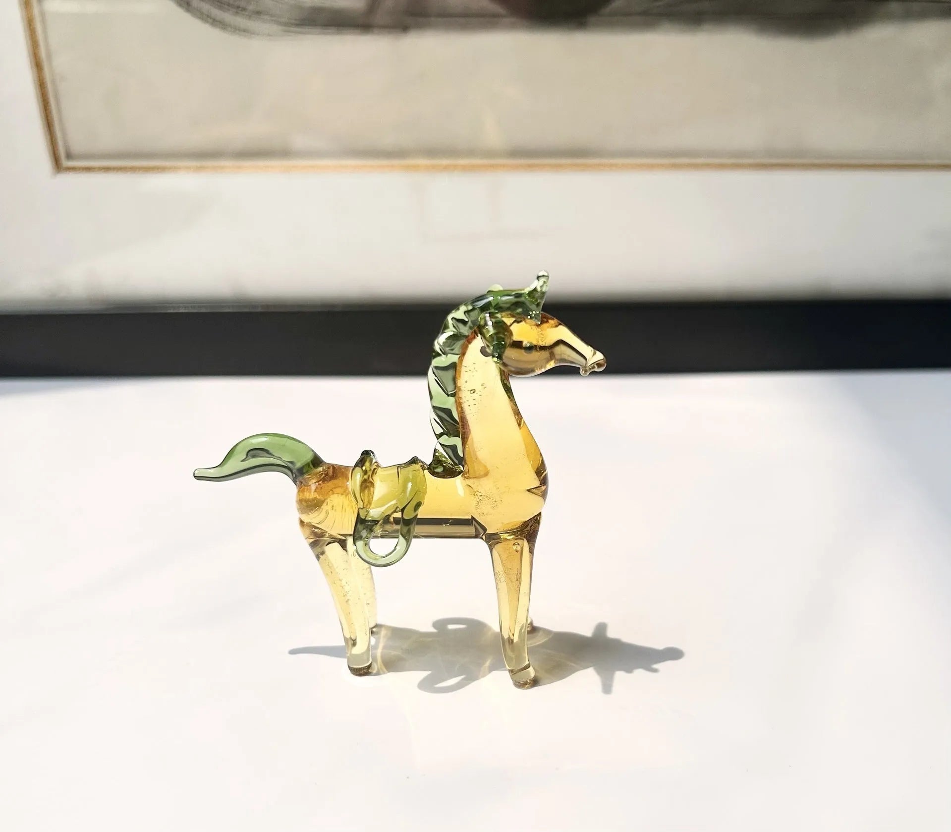 Brown coloured glaze horse decoration on wooden desk