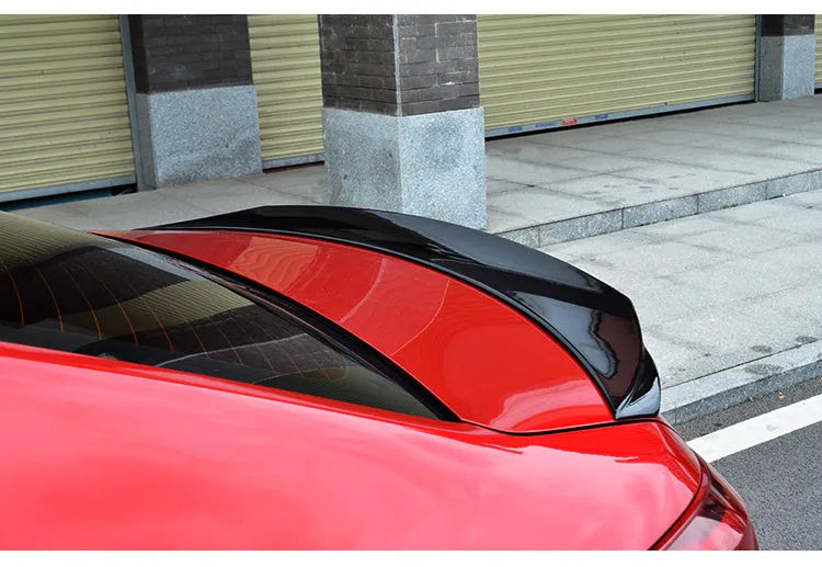 Bright black tail trim spoiler blade for Mazda 3 Axela and Exela car model.
