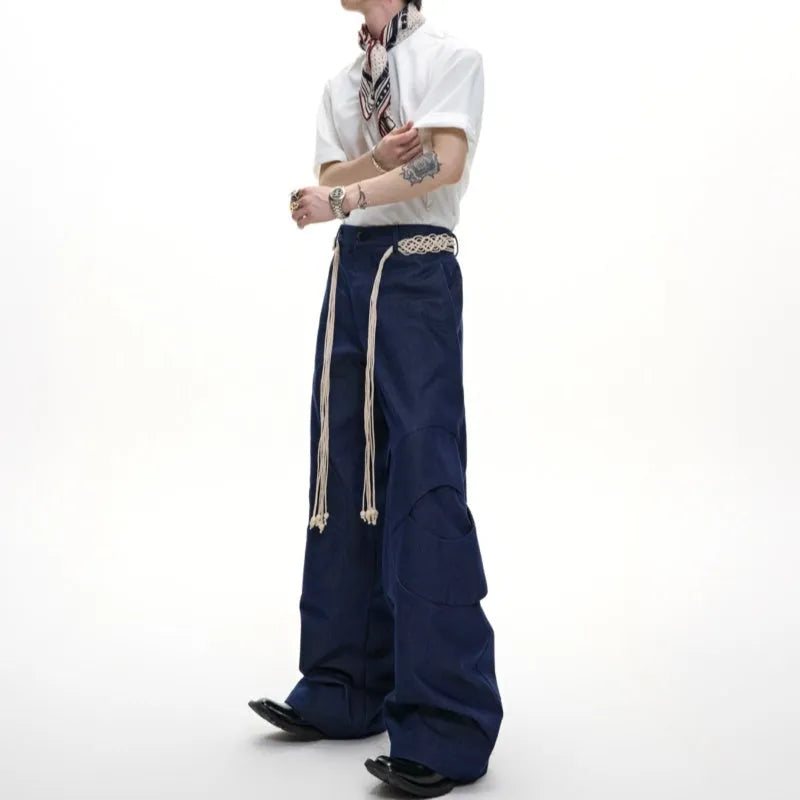 Men's straight leg jeans with 3D texture, belt stitching, and decorative zipper details in dark colour