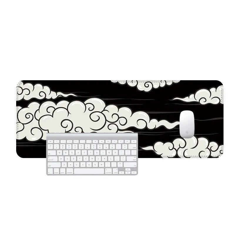 Large grey desk mat with minimalist geometric pattern, covering keyboard and mouse on a wooden desk.