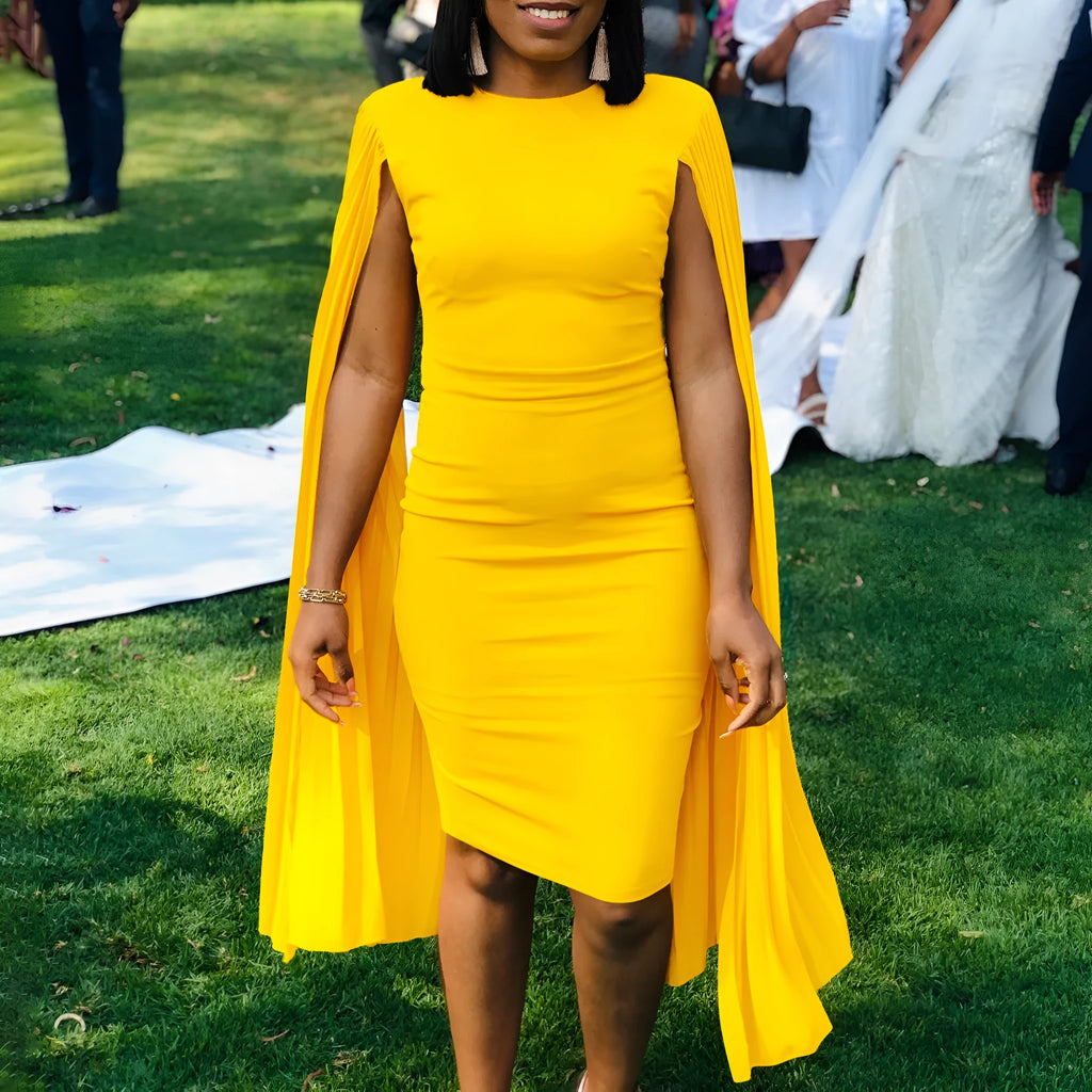 Women's yellow high-waist evening gown with round neck, long sleeves, and a pleated shawl detail.