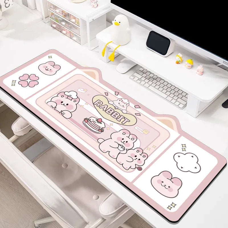 Oversized natural rubber mouse pad desk mat in pink bunny design on desk surface
