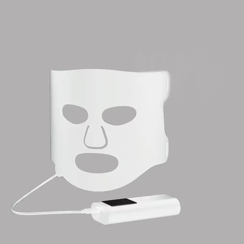 Black and white LED phototherapy face mask with controller for home skin light therapy.