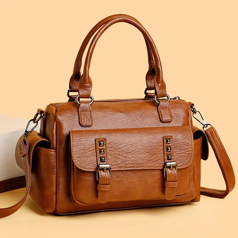 Vintage-style large messenger bag in PU leather, showing horizontal square shape and contrast stitching.