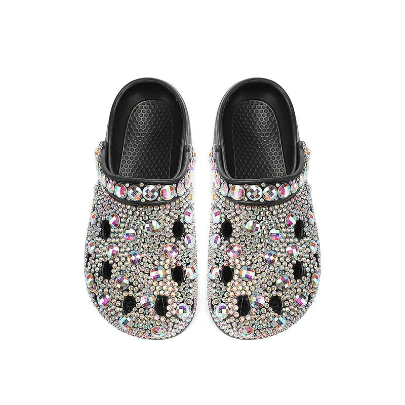 Black women's platform sandals with a hole design and rhinestone details on a lightweight EVA sole.