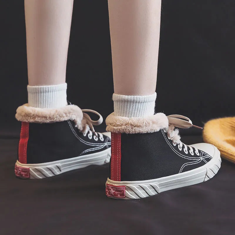 Black women's winter canvas shoes with velvet lining, animal pattern, buckle fastening, low-top rubber sole.