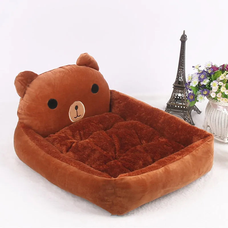 Blue cartoon-style sofa pet bed with a removable padded cushion for a small dog or cat.