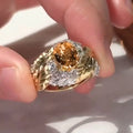 Gold coloured embossed feather ring with geometric design and yellow zircon stone inlays