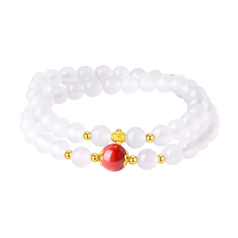 White agate bracelet with jequirity bean and cinnabar beads, 6mm polished geometric shape