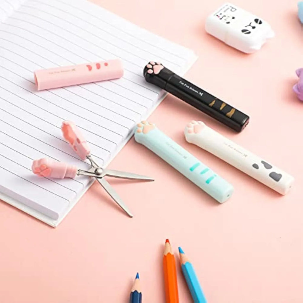 Mini folding craft scissors with cat paw handles in four colours: black, blue, pink, and white.