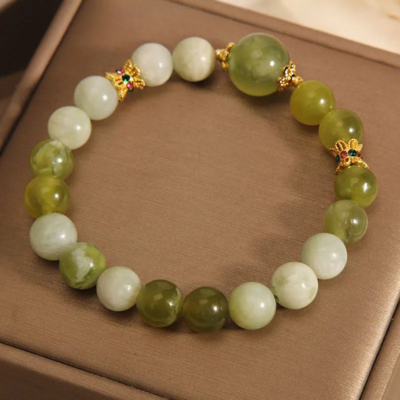 Xiuyan jade women's bracelet in jade green colour with natural stone patterns and Mori-style design