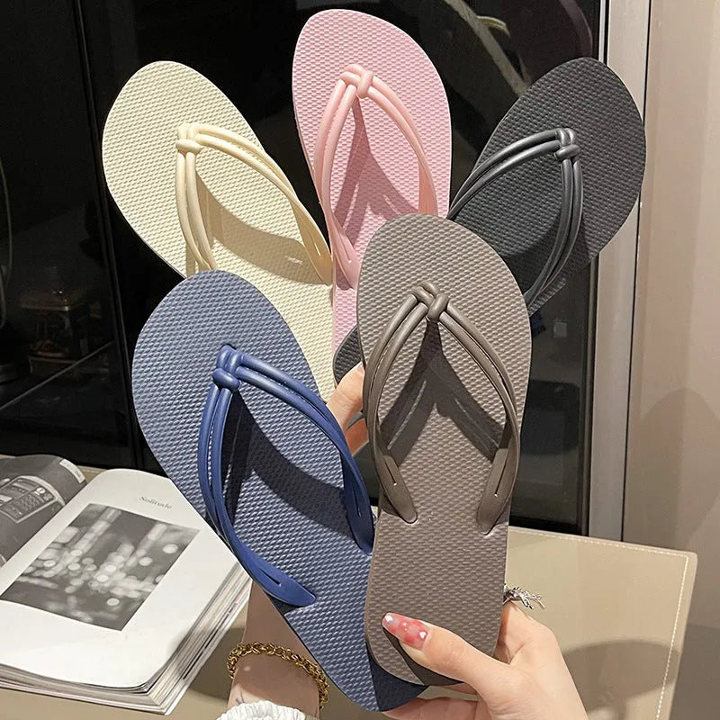 Men's PVC toe covering flip flops in beige on a plain background, showing non-slip sole.