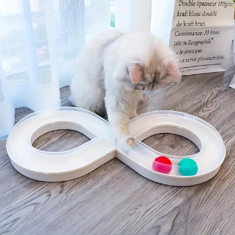Blue and white circular cat turntable track with four spinning balls and teasing stick for feline play