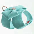 Dog wearing microfiber chest strap with decorative bow knot in blue colour