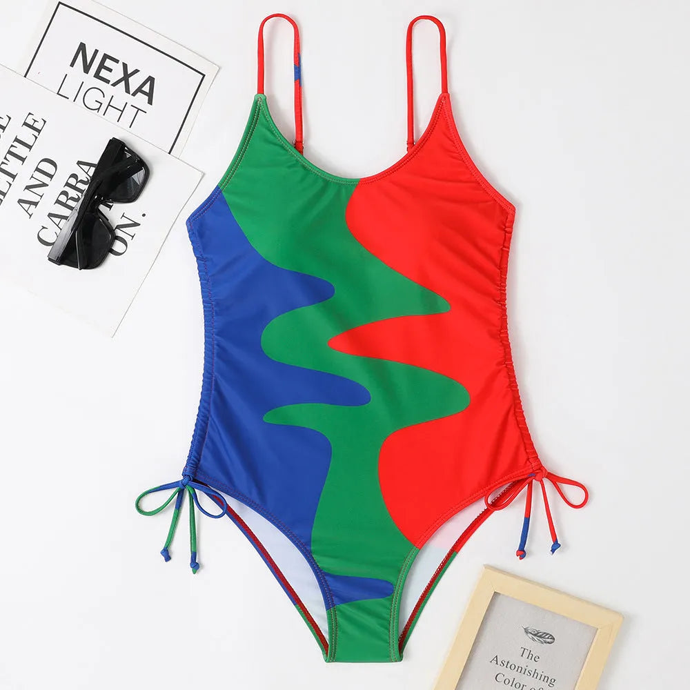 Women's sleeveless one-piece swimsuit in a striped print, showing backless design and available in multiple colours.