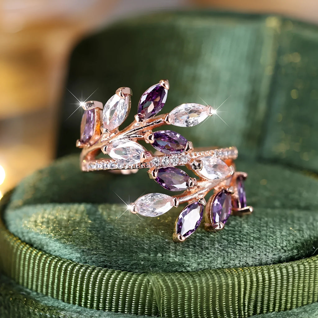 Adjustable horse eye zircon leaf ring in copper on a hand, showing leaf detail and colour options.