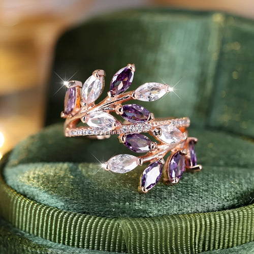 Adjustable horse eye zircon leaf ring in copper on a hand, showing leaf detail and colour options.