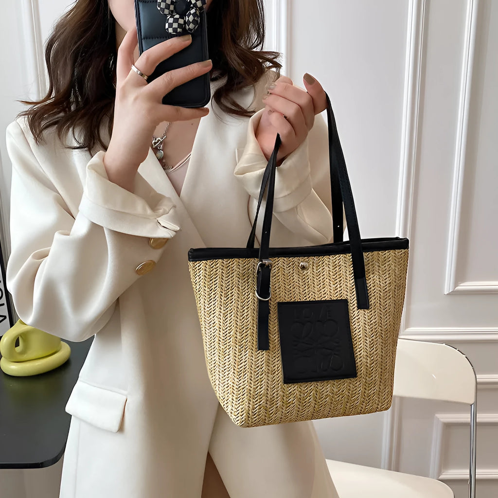 Straw woven women's shoulder bag in black showing European retro style with three-dimensional pocket