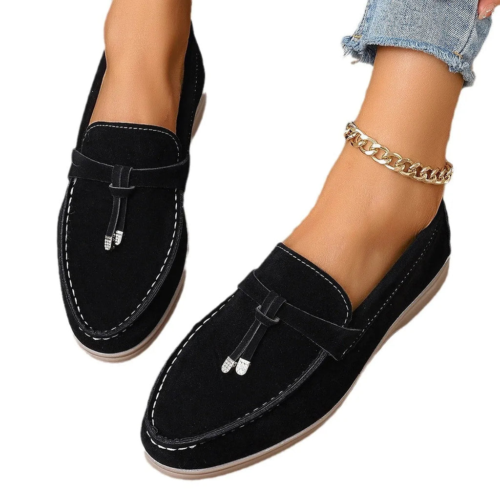 Casual canvas slip-on loafers with a round toe and platform heel, shown in a choice of colours.
