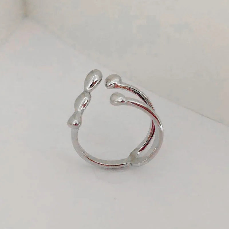 Brass fashion ring with spherical design in gold or silver colour for women's jewellery