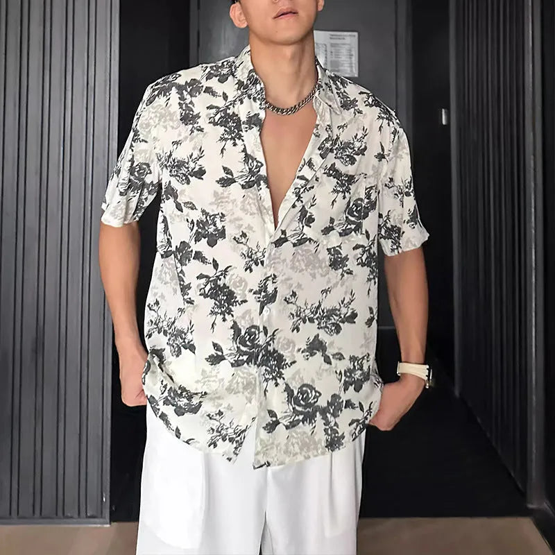 Loose casual short sleeve shirt with floral printed pattern and V-neck design in white colour