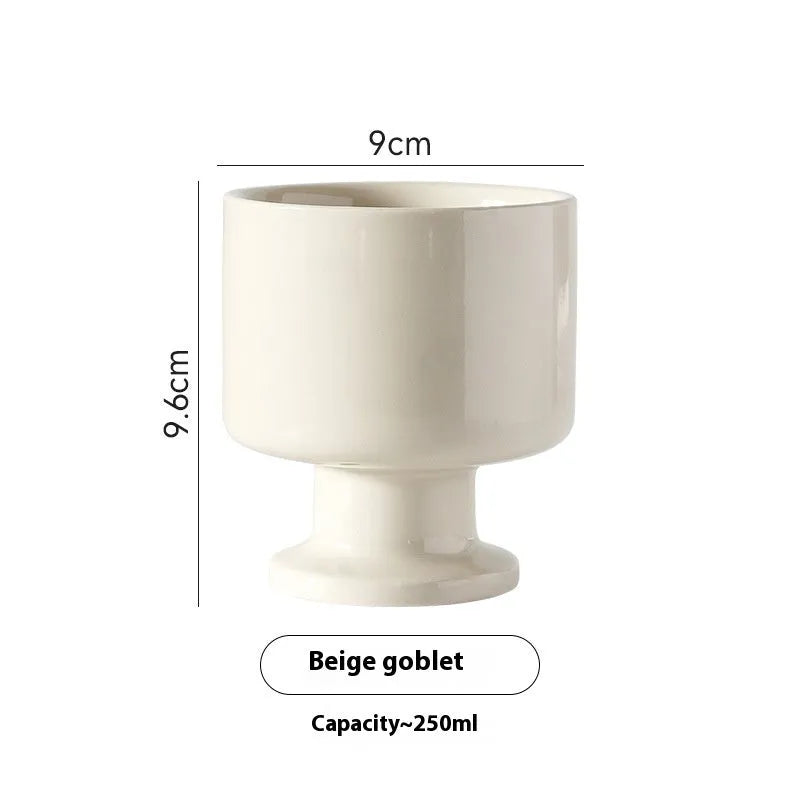 Handmade ceramic mug with irregular shape in solid colour