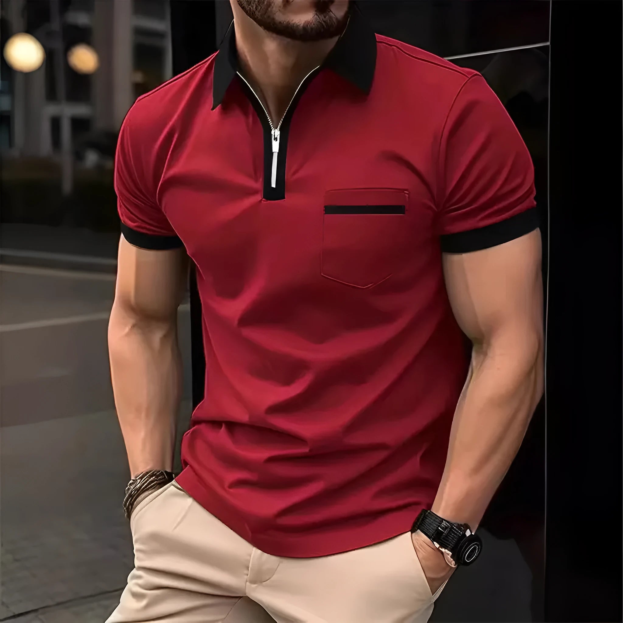 Man wearing a loose-fit casual short sleeve shirt with a chest pocket and zipper decoration.