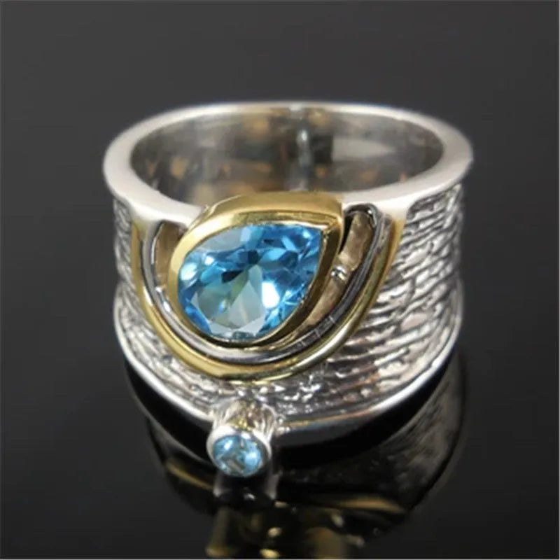 Blue zircon Chinese style drop shape alloy ring with rhinestone detailing on silver-toned band