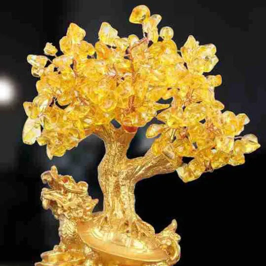 Citrine-coloured Chinese style resin turtle money tree ornament on display.