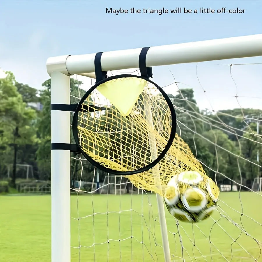 Portable black and yellow soccer training goal net set up on a grass field.