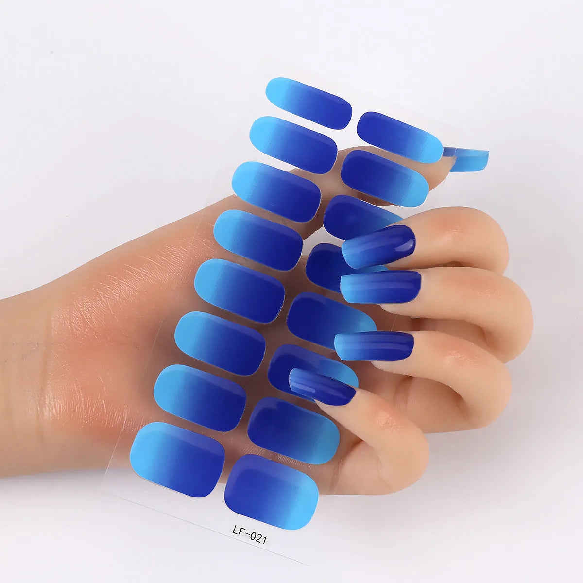 Set of 16 solid colour nail art stickers showing floral, geometric, and pattern designs for manicure application