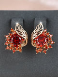 Round floral earrings with feather detailing and coloured zircon stones in champagne gold finish