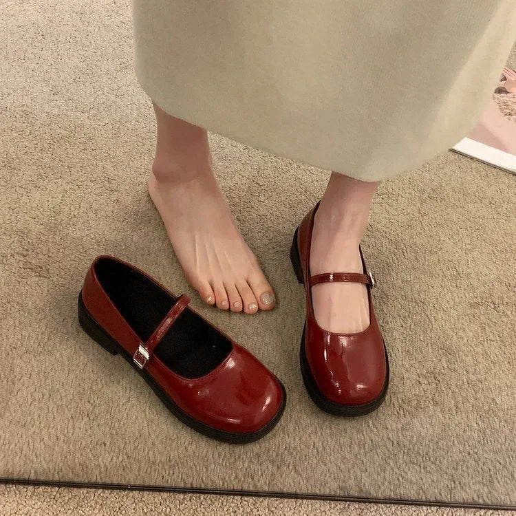 Women's red French vintage flat shoes with round toe and solid colour PU upper.