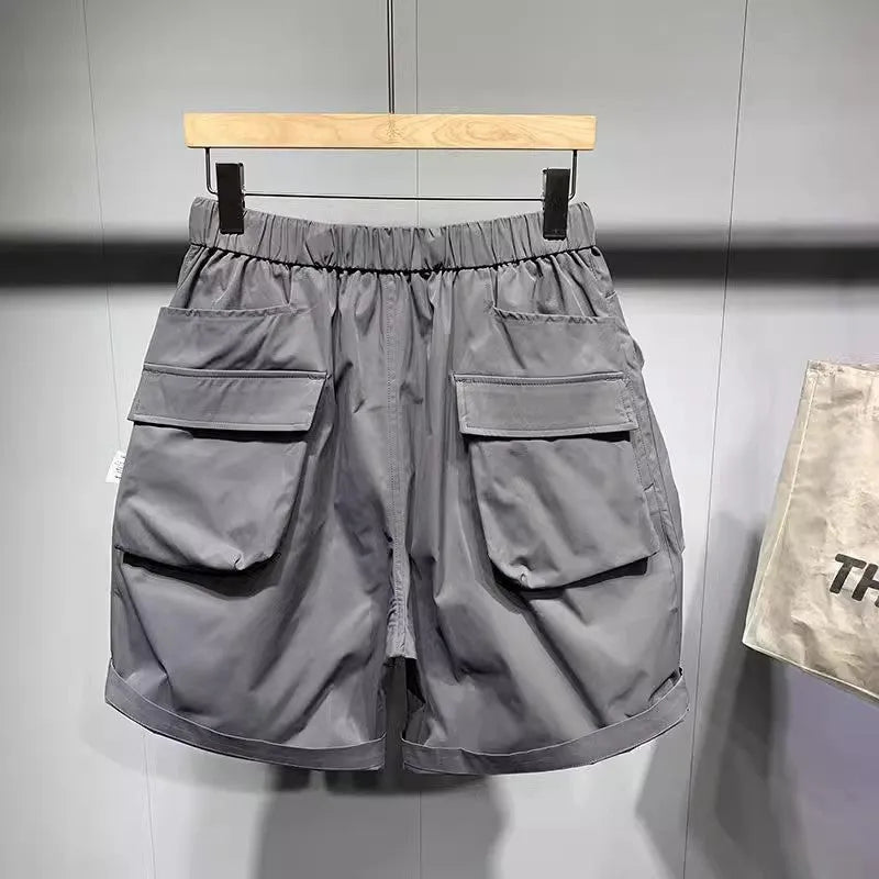 Large size men's black work shorts with pockets and straight leg hem