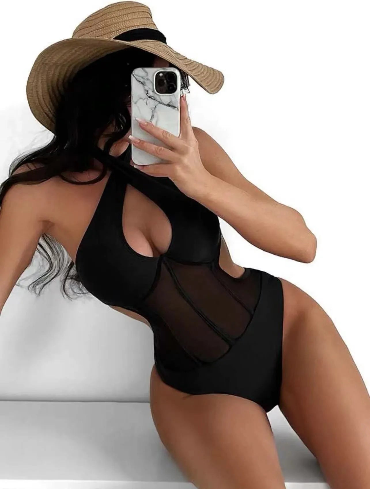 Women's black one-piece swimsuit bikini made from nylon and spandex fabric on a mannequin