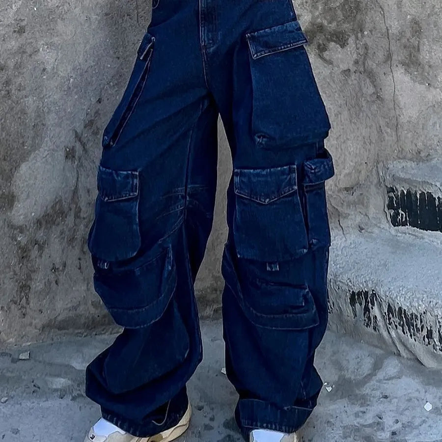 Dark blue distressed wide-leg jeans with a high waist and multiple pockets on a model.