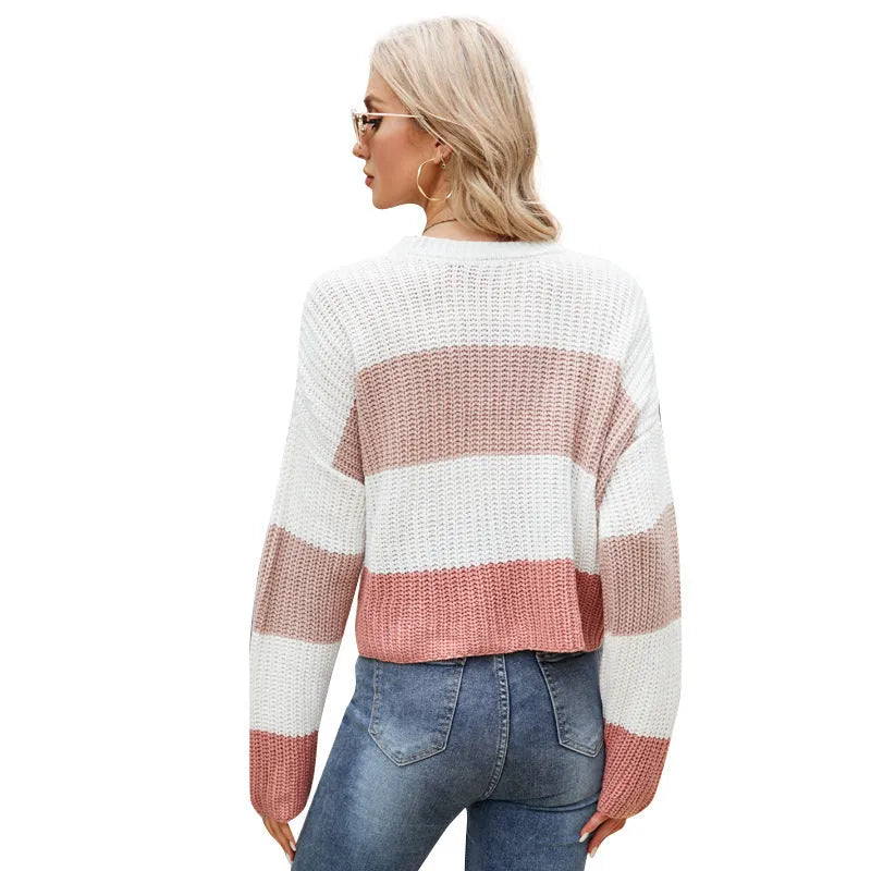 Short length women's striped pullover jumper in pink, dark blue, or yellow.