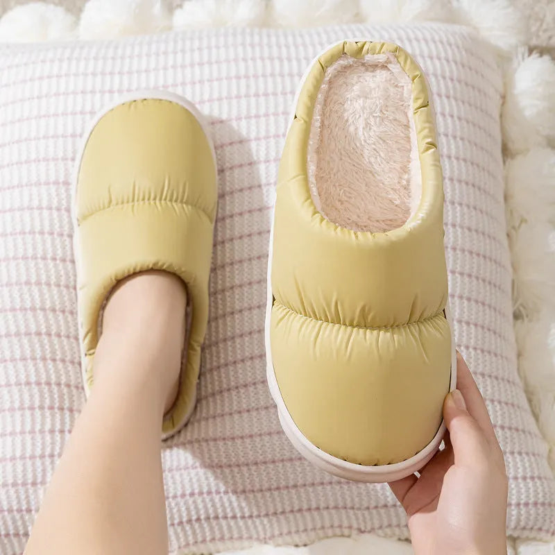 Blue winter slippers with artificial leather upper and thick rubber sole, showing plush lining.