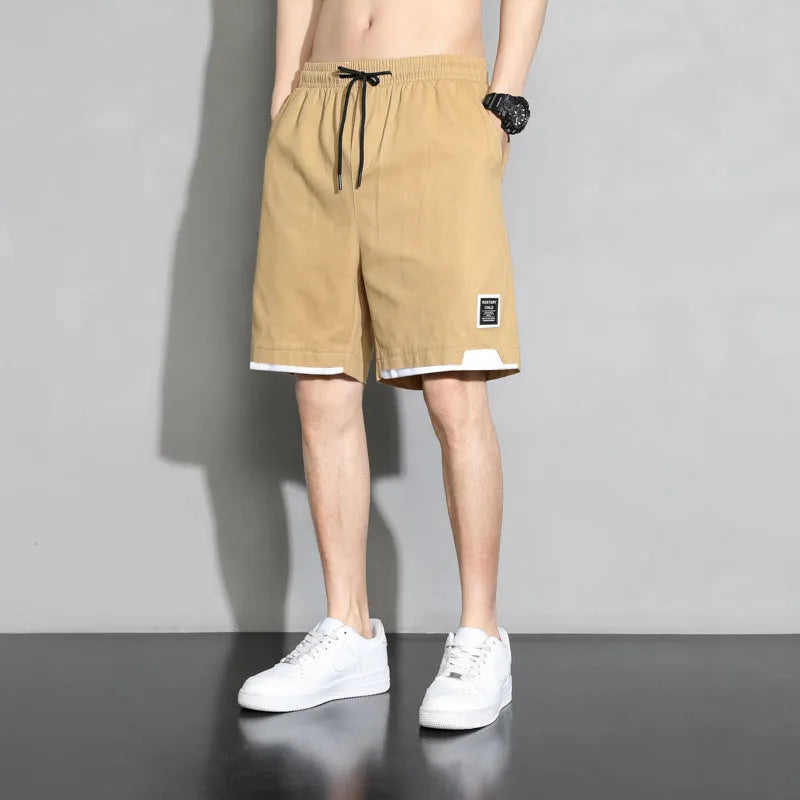Boys' loose-fit cotton shorts in black, available in plus sizes for summer comfort.