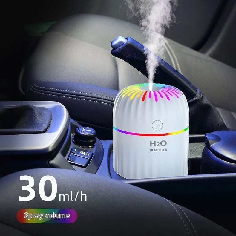 Small green animal-shaped USB humidifier for car and desktop use.
