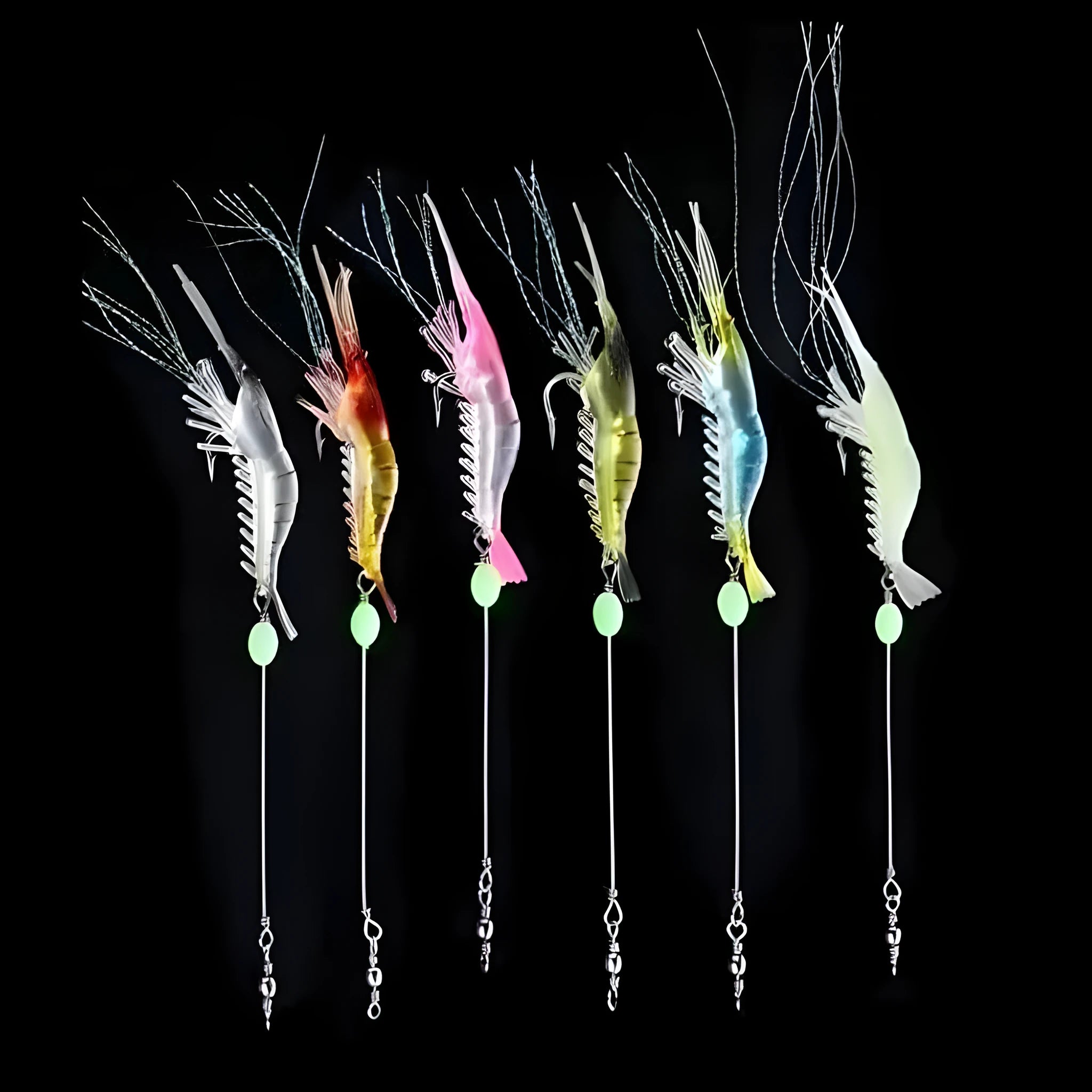 Six soft fishing lures with hooks in different colours including luminous and transparent variations