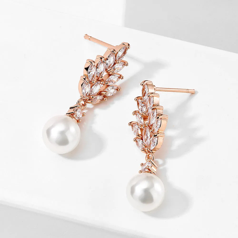 Geometric flower earrings with micro inlaid zircon and pearl detailing in gold plating