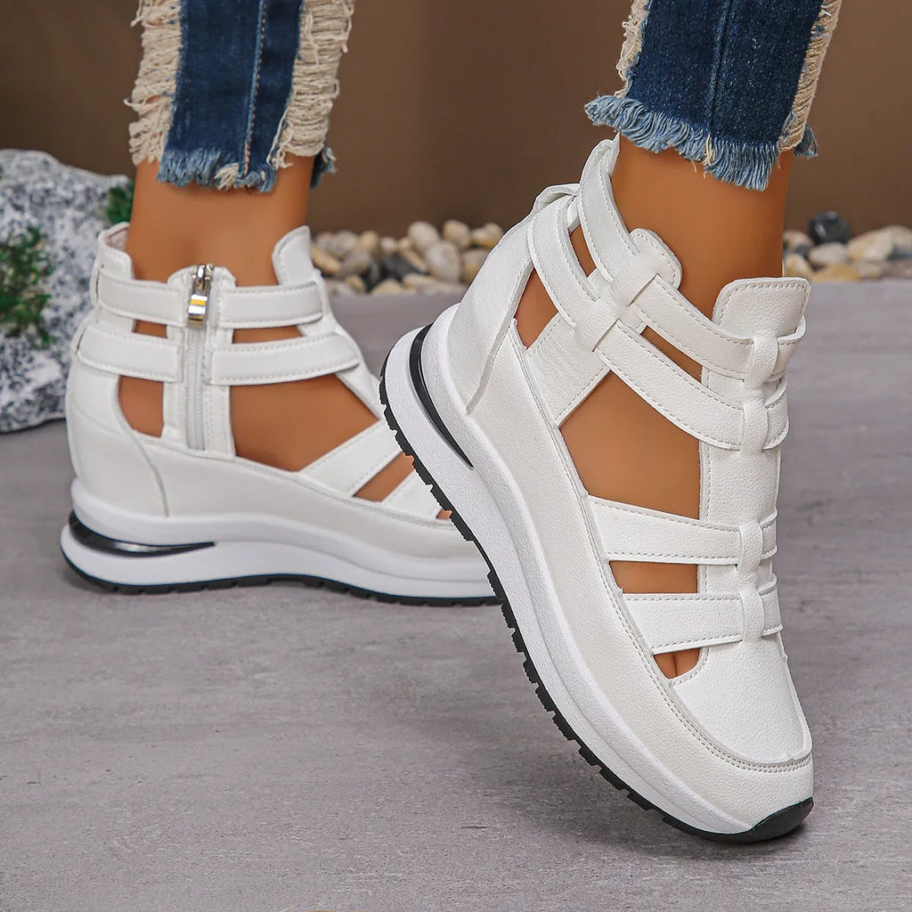 Women's black close-toed platform sandals with Velcro strap and hollow-out design.