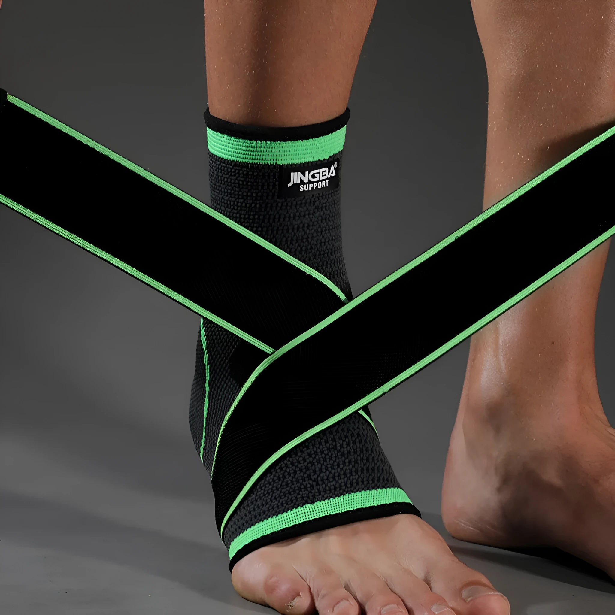Black sports ankle support strap with Velcro fastener, shown unwrapped.