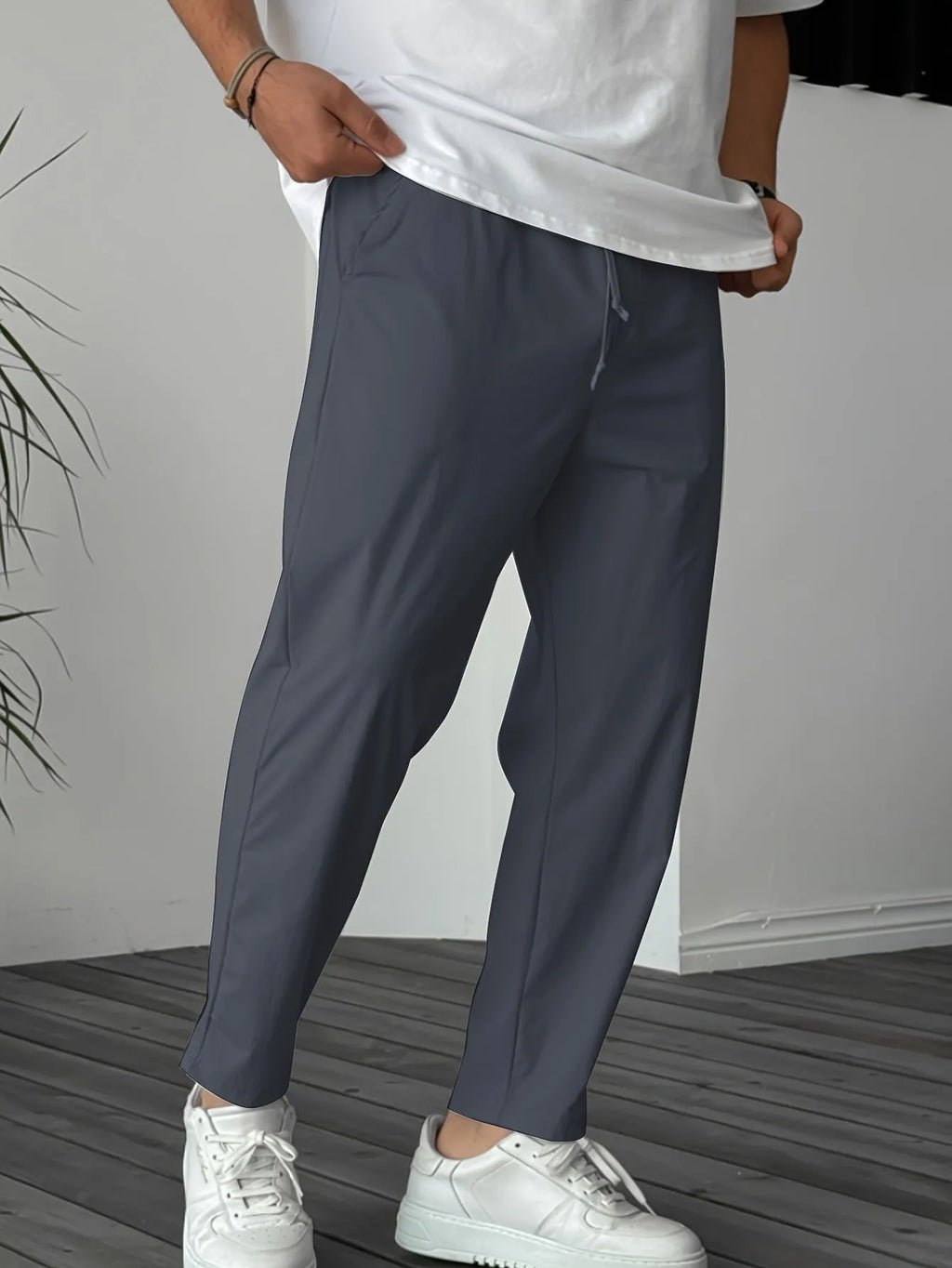 Men's khaki straight-leg drawstring casual trousers with a ribbon pocket detail.
