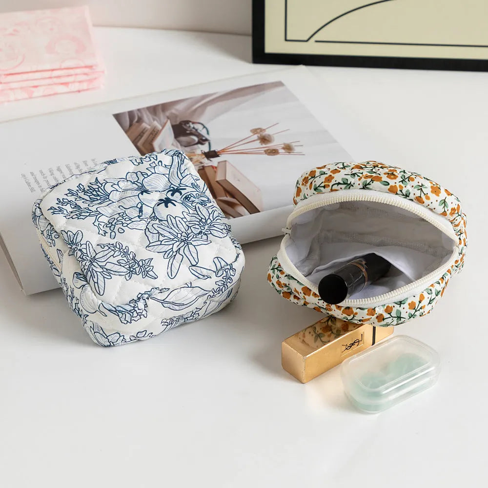 Breathable polyester key storage bag showing multiple floral and cherry pattern options including white background designs